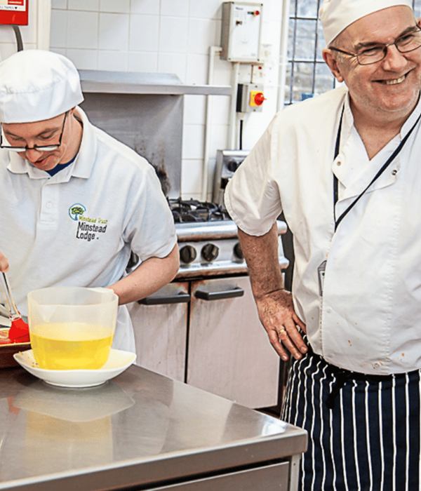 Two people working in the kitchen showing how our team support people with learning disabilities.