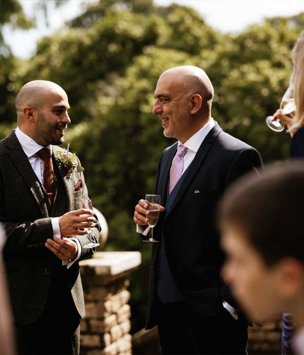 Two people enjoying a glass of prosecco outdoors