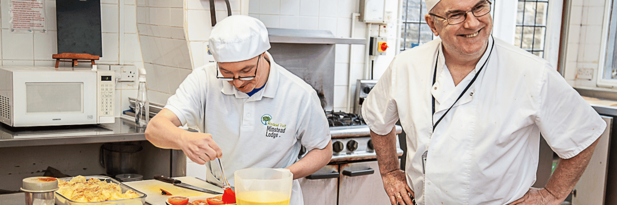 Two people working in the kitchen showing how our team support people with learning disabilities.